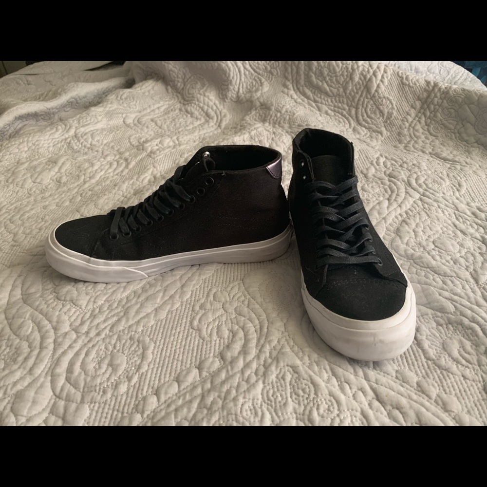 Vans black and white midtop court shoes